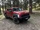 KIA - TASMAN_X-Pro red front